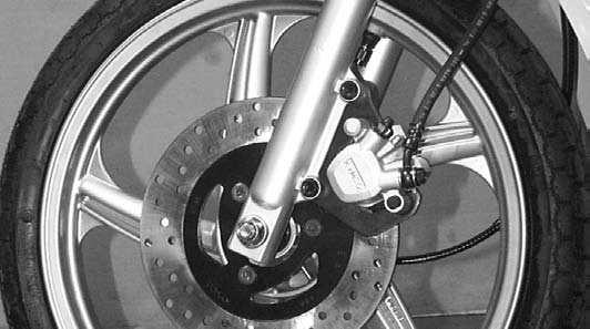 When operating the brake lever, the brake reservoir cap must be tightened securely to avoid spill of brake fluid.
