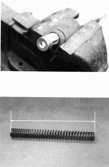 13. STEERING HANDLEBAR/FRONT WHEEL/FRONT BRAKE/FRONT SHOCK ABSORBER/FRONT FORK Use a vise to hold the front shock absorber tube and remove the damper from the shock absorber tube.