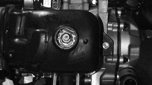 7kg-m Cylinder head Bolts Cylinder Head Spark Plug Engine Hood Installation Install the engine hood.