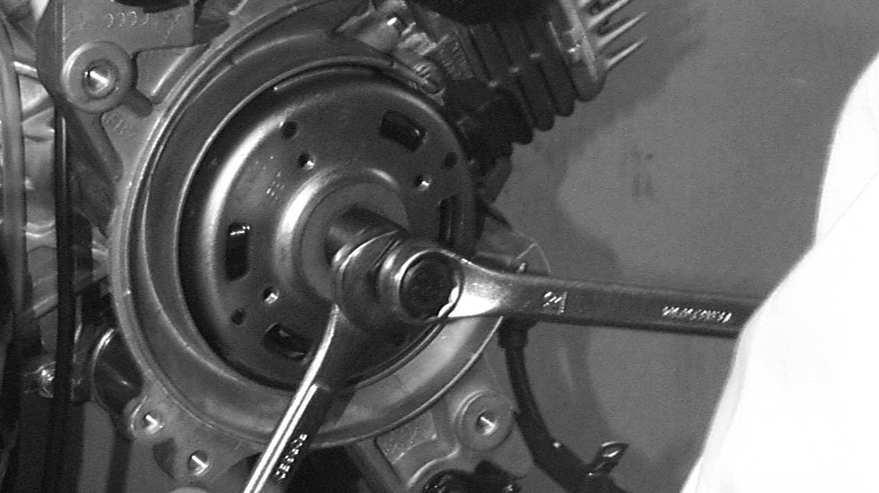 7. A.C. GENERATOR Remove the A.C. generator flywheel using the flywheel puller. Lock Nut Wrench Flywheel Puller Remove the A.C. generator wire connector.