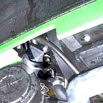 13. Drain anti-freeze from engine before proceeding. It may be necessary to remove tractor hood side panels as well as air breather in order to provide better access for heater installation.