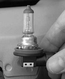 Pull the headlamp assembly toward the front of the vehicle to access the bulb assembly. 3.
