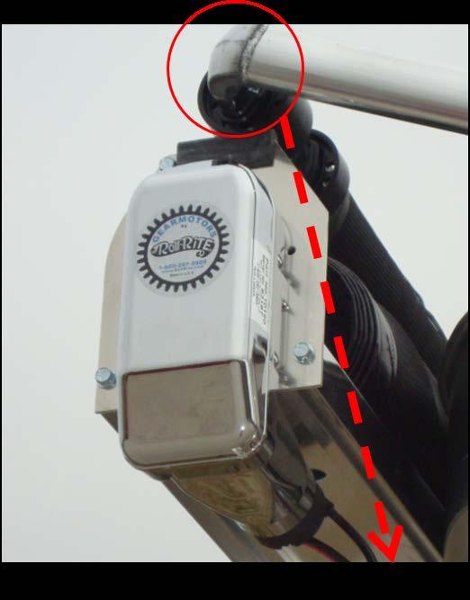 Figure 3: Securing the Tarp Arm with a Strap Prevent Movement During Motor Brake Removal ii.