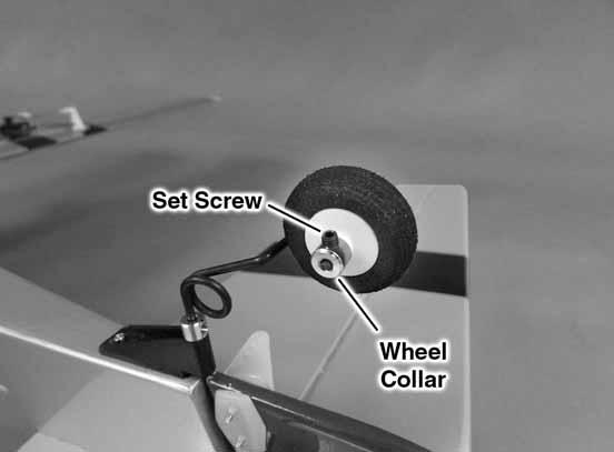 9. Install the tail wheel, securing it with the wheel collar and set screw. 11. As you did with the ailerons, drill 1/16" [1.