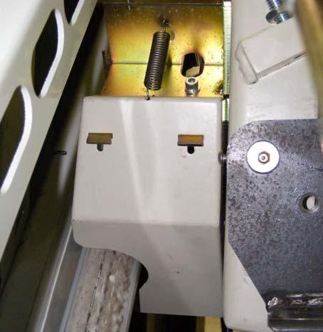 c. Adjust the lower limit assembly (as required) along the teeth of the rail and then secure in place. For fine adjustment, you can adjust the limit switch position as described below.