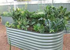 RAISED GARDEN BEDS Manufactured in a variety of sizes & colors from poly coated,