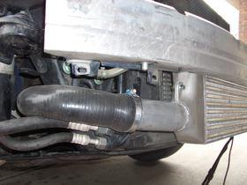 16) Attach the intercooler core to the bumper support, being sure to center the core in the bumper.
