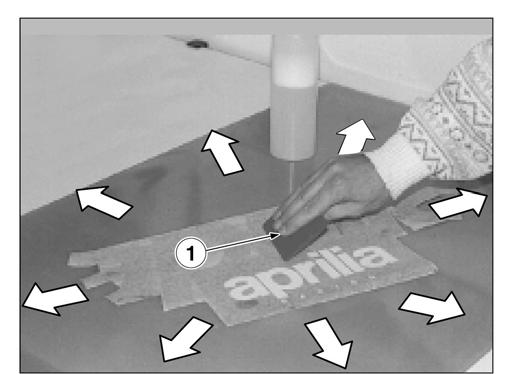 To apply decals, proceed as follows: Position the decal (3) in upside-down position on the work bench. Keep the decal flat and pressed on the work bench and remove the protective film (4) completely.