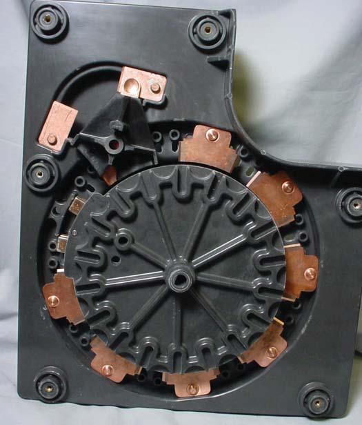 See Figure 16. 3. By hand rotate the main movable contact and Geneva gear assembly so that the movable contact is in the stationary one contact position.