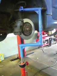 The tool works to quickly and safely lift or raise bridge type McPherson Struts (where the hub can be separated from the strut) without the removal of the ball joint and drive
