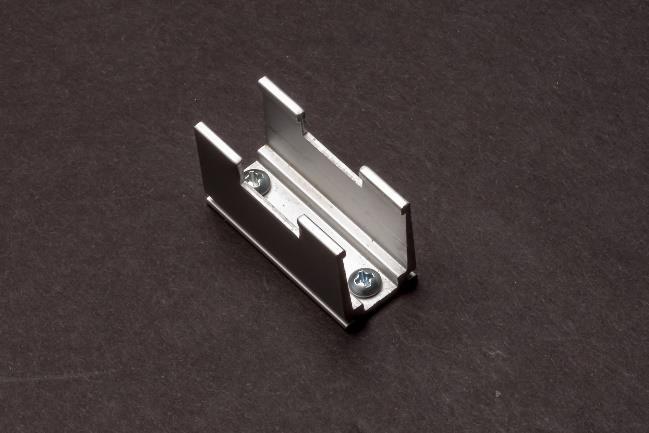 Mount the clip to a flat surface using the two included