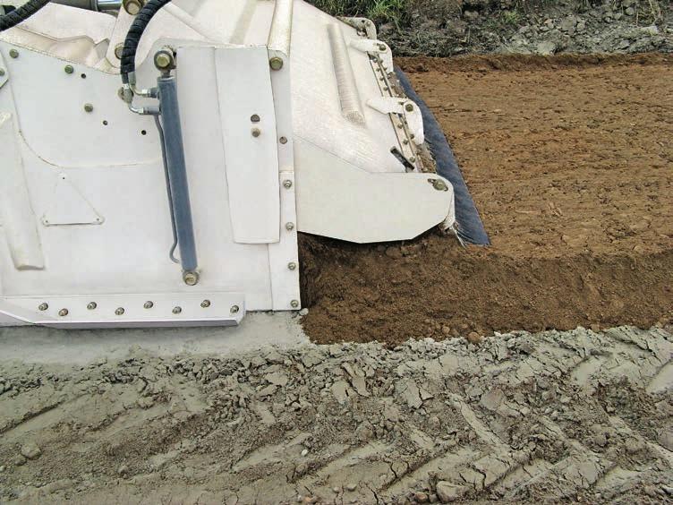 Soft soil is covered with lime spread by, for instance, a binding agent spreader prior to treatment.