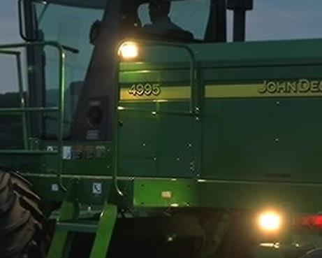 Section 4: Self-Propelled Windrower RE154906 Additional Lighting Kit 4895 and 4995 Four additional working lights are available as a field-installed