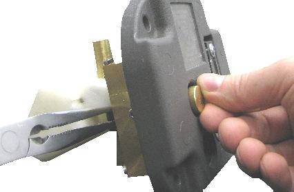 replace the test spring and test knob and tighten them using your fingers on the test knob and needle nose pliers on the back.
