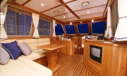 Her interior is finished in hand crafted American Cherry and her layout includes a private owners stateroom forward, a large head with circular acrylic shower