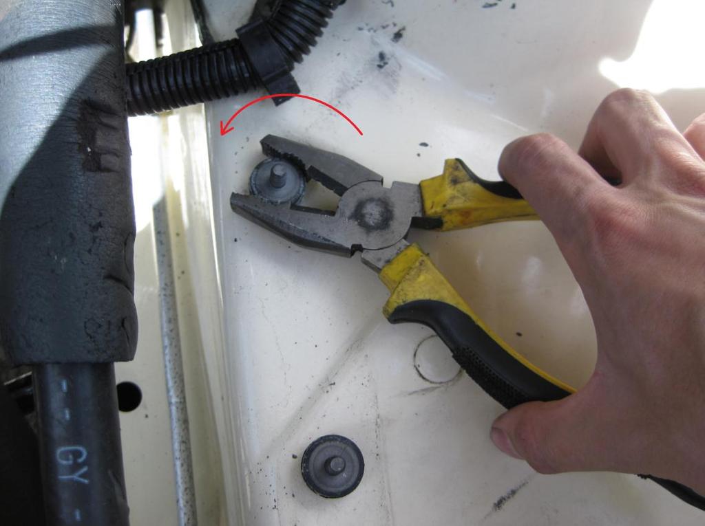 Using pliers (or vice-grips if required) grip the rubber bush, DO NOT grip the actual stud as the