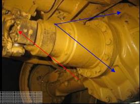 All universal joints must be free of contaminated grease (red arrow).
