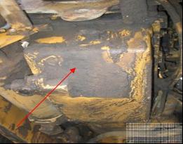 Another view of how contaminated the underside of the engine block and sump can be (red