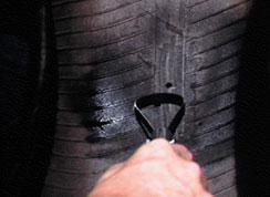 Ream the tire injury (from the outside), using a 