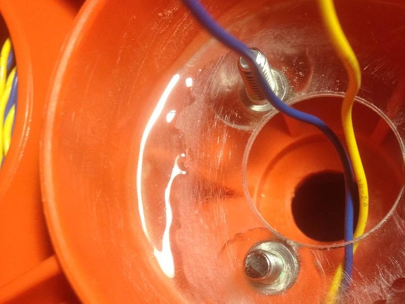 the slip ring mount and pull the tether through the center hole.
