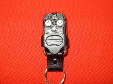 Rollerdor RD77 Econ Roller Garage Door 6. PROGRAMMING REMOTE CONTROL HANDSETS (HOLD TO RUN) 1 Slide the black cover down on the remote control handset and you will reveal four buttons (fig 6.1).