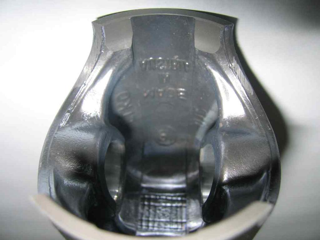Piston with ring assy. 3.1 3.2 Original, coated or uncoated, aluminium, cast piston with one piston ring. The piston has to show on the inside the cast wording "ELKO" (1) and "MADE IN AUSTRIA" (2).