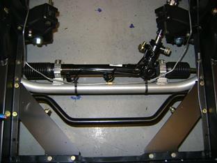 The next photo shows the rack installed on the cross member and in the car.