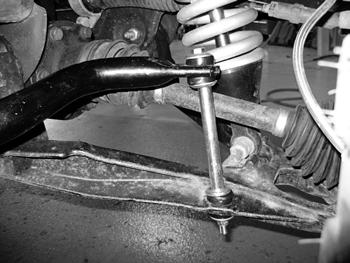 FIGURE 40 81. Connect the steering tie rod ends to the knuckles with the short provided nylock nuts. Ensure the nut has full thread engagement. Torque to 44 ft-lbs.