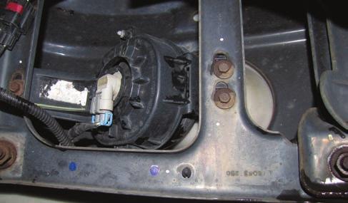 11 Mount the air compressor / solenoid assembly of the driver s side bumper support brace shown in the photo.