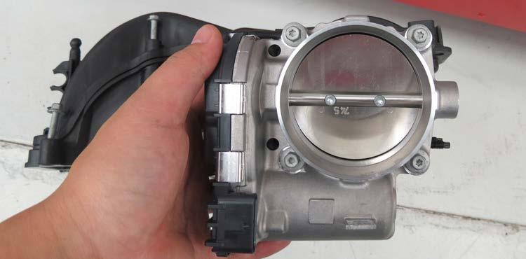 86. Remove the factory throttle body from the manifold using