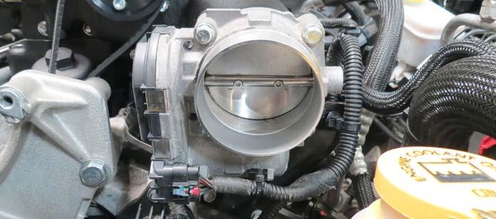 Remove the factory throttle body gasket from the manifold and