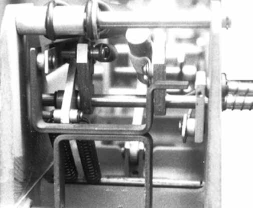 Slide shaft through frame, new cam, new lever, old spacer, remaining old lever, new C ring (Item 19), and frame (Figure 11). 2. Use a punch to drive roll pin from shaft. Discard roll pin. 3.