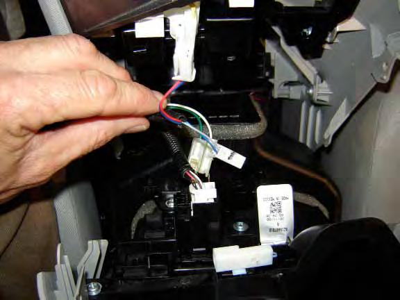 Repeat on Drivers side. e. Connect LED module connectors to previously installed Light Guide assemblies. f. Reinstall center console storage box. 1.