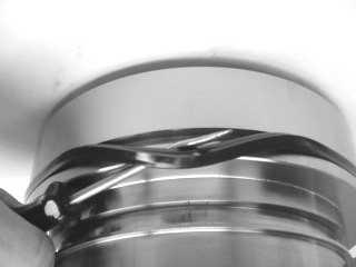 Install the ID cup seal (200) into the piston sleeve