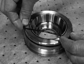 Ensure the concave side of the B/U seal faces the O-Ring. The T20-45 does not include a spacer ring. Instead it features a complete seal groove.