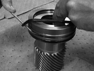 cup seal (202) onto the piston sleeve (03).