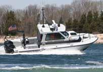 scuppers Haze grey gelcoat Heavy-duty rub rail Cabin accent stripe Pilothouse with locking lower cuddy Pilothouse, cabin roof and pilot rails Windshield wipers and fans Fixed forward windows Sliding