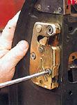 Take great care when inserting the new latch not to damage the bent rod type lever arm which operates the