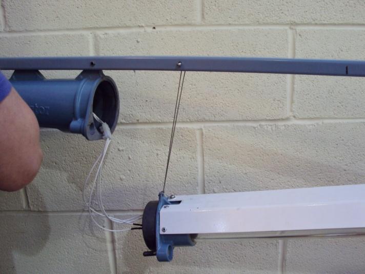 INSTALLATION a) Mounting The luminaire is supplied with mounting brackets as shown in the diagram on the front of this leaflet. The luminaire must be securely fastened to its supporting structure.