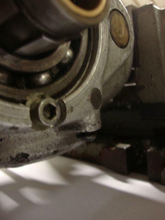 Tighten the standard BSA fork spindle retaining screw (highlighted above) to hold the fork