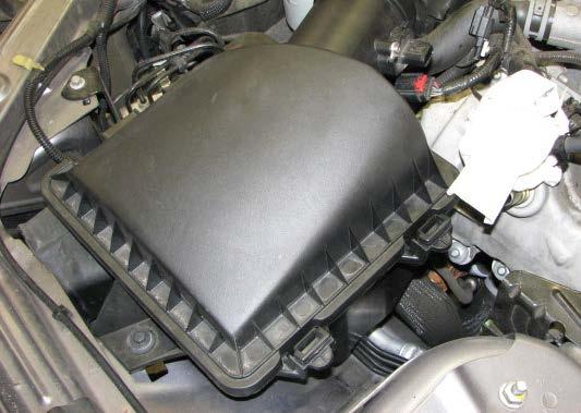 27. Unlatch the air cleaner cover, then use a Torx-20 driver to remove the MAF sensor from the