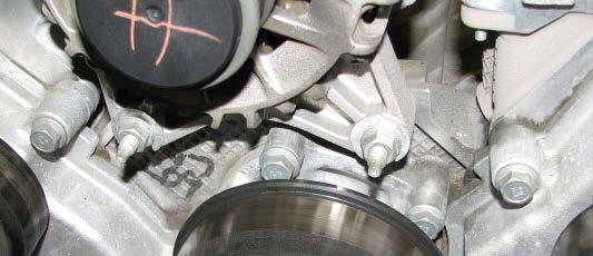 Use a 10mm socket to remove the two outer alternator bracket bolts, and an 8mm socket to remove