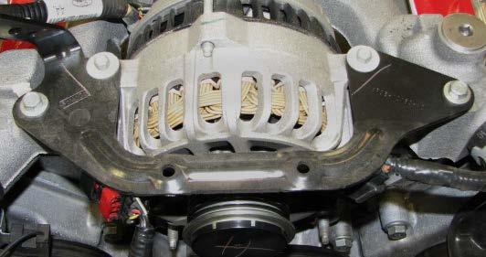 Use a 10mm socket to unbolt the air cleaner housing and remove it. 32.