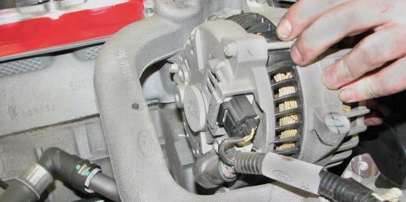 bracket, then disconnect the alternator electrical connector.
