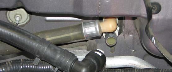 with the stock bolt. The lower hose and larger diameter hard line can be discarded. 86.