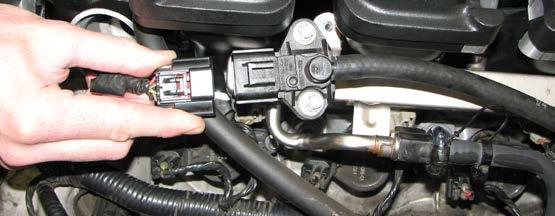 Install the 3/8 vacuum hose attached to the rear of the manifold onto the brake booster nipple and