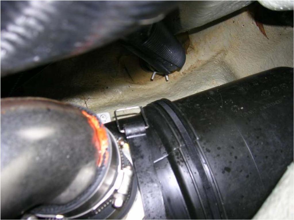 Once you unhook the J pipe, hose, and waterbox you can slide the entire exhaust assembly back about 2 3 inches.