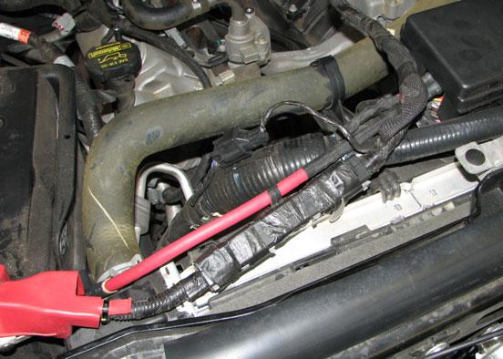 Use a 10mm socket to remove the four bolts that retain the upper alternator strap. 23.