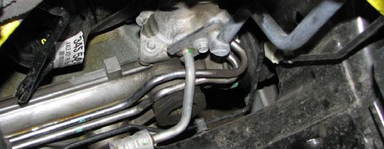 Use an 18mm wrench to remove the power steering pressure line from the under side of the pump.