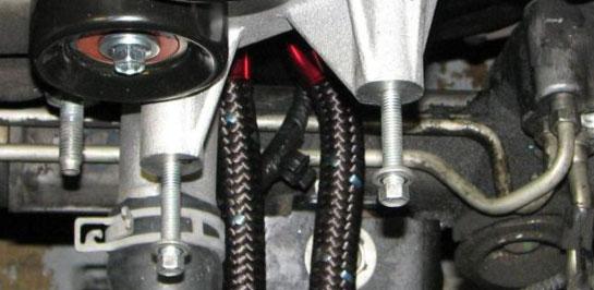 Insert the plastic elbow fitting into the supplied lower radiator hose and secure it with the supplied hose clamp. 92.